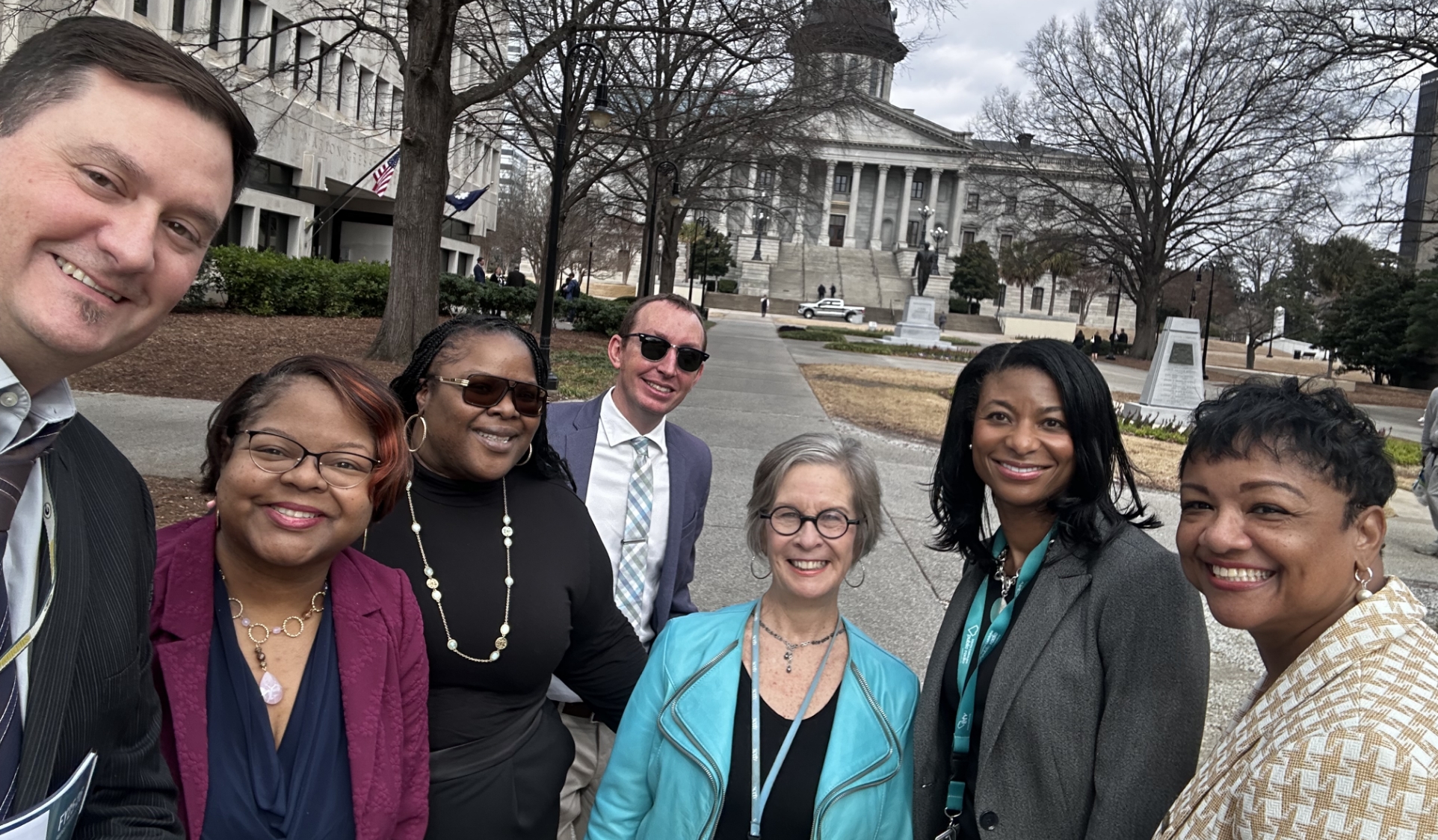 Group of people in front of the state capitol